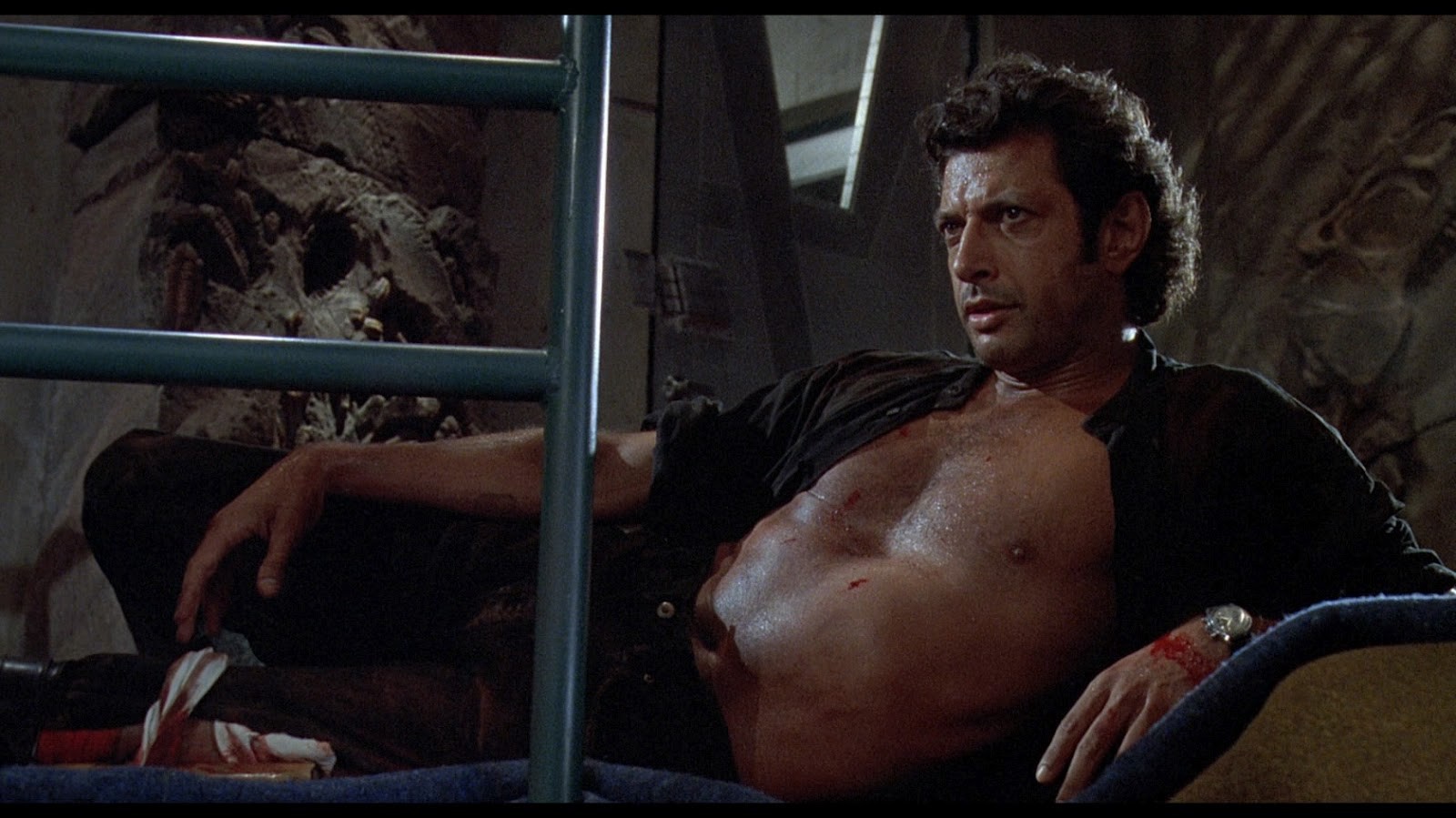 Jeff Goldblum as Dr. Ian Malcolm in Jurassic Park, shirtless and in a come-hither pose.
